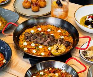 Paella with bomba rice, Spanish chorizo and grilled steak